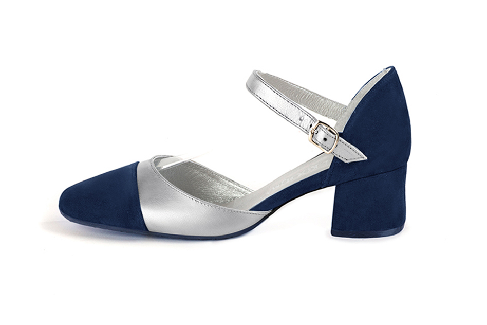 Women's navy blue and silver open side dress shoes, with an instep strap. Round toe. Low flare heels - Profile view